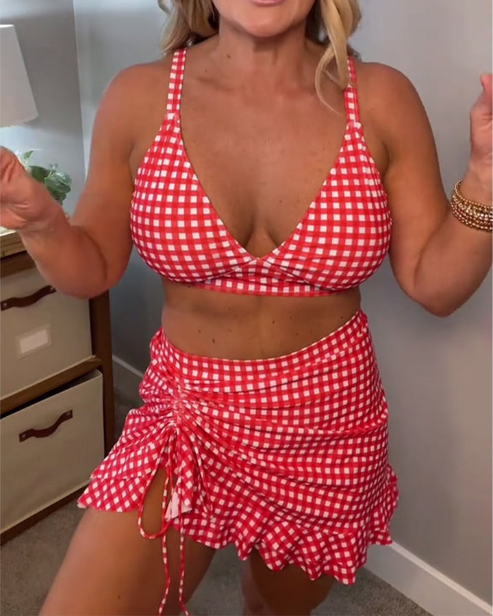 Two-piece swimsuit with a relaxed check print and straps.